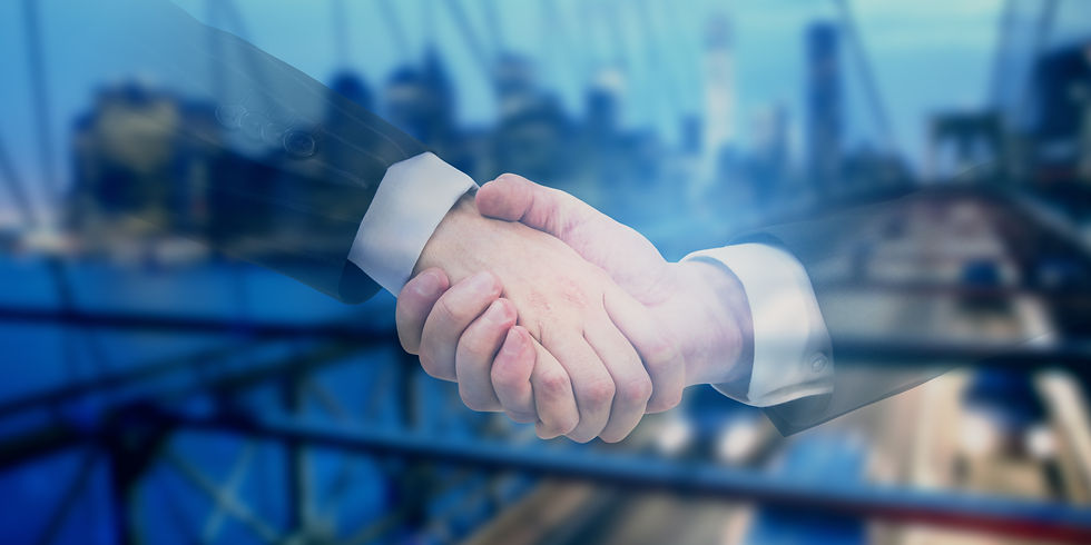 Close-up view through window of lawyers shaking hands in partnership