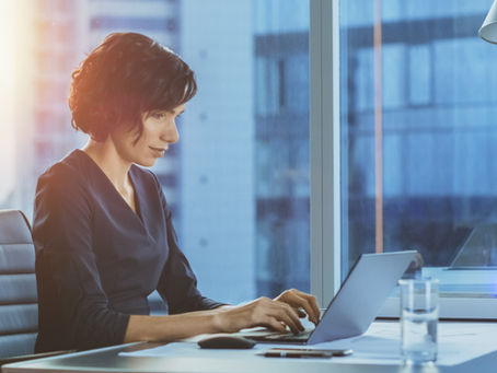 ERISA female Attorney working on liens at desk